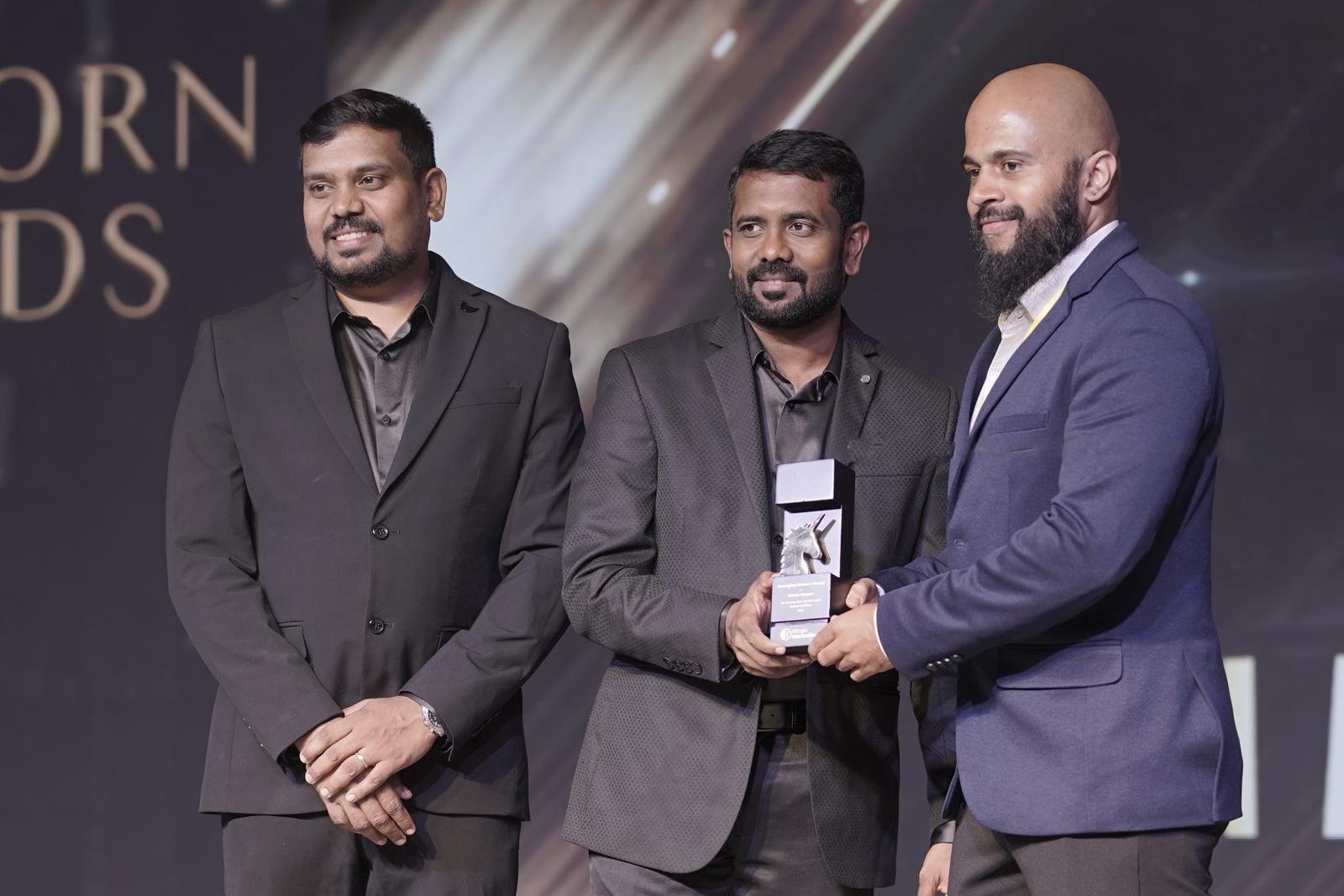 Vishak Moopar receiving an award